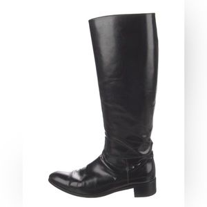Church’s riding boots.